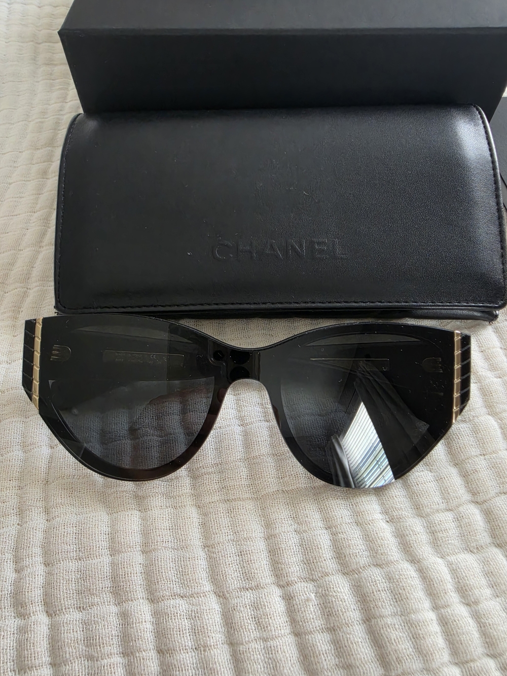 CHANEL Black Cat-Eye Sunglasses with Gold Trim